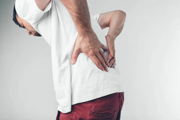A man holding his penis with on the white background — Stockfoto