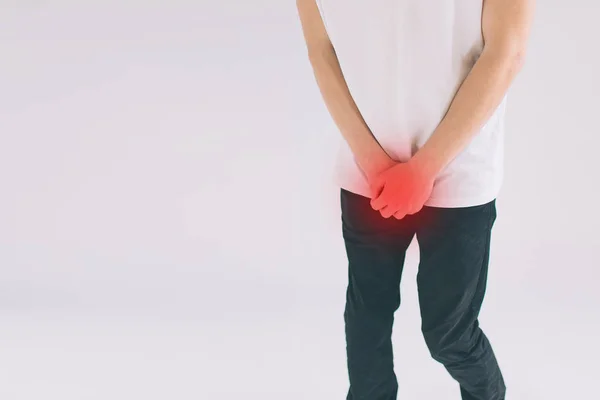 A man holding his penis with on the white background. Wants to go to the toilet. isolated on White Background. — Stockfoto