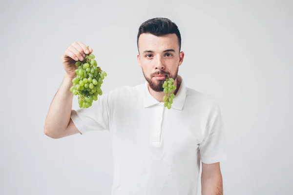 Man holding grape, close up. concept. isolated on white — Stock Photo, Image