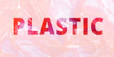Plastik yazılı plastik bir poşet. Çevre kirliliği, üretim, ekoloji kavramı. Çoklu maruz kalma, çift maruz kalma.