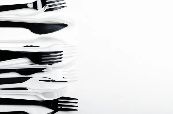 Plastic White Black Disposable Forks Knives White Background Plastic Dishes — Stock Photo, Image