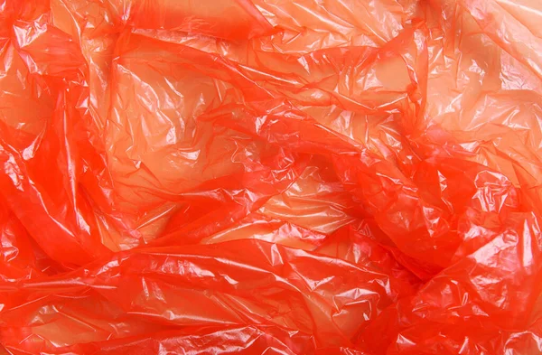 Röd Wrap Förpackning Polypropylen Plastförpackning Beige Bakgrund Konceptet Med Föroreningar — Stockfoto
