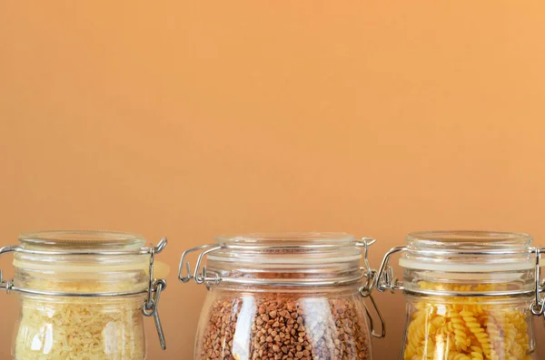 Glass Jars Uncooked Cereals Pasta Rice Buckwheat Beige Background Zero — Stock Photo, Image