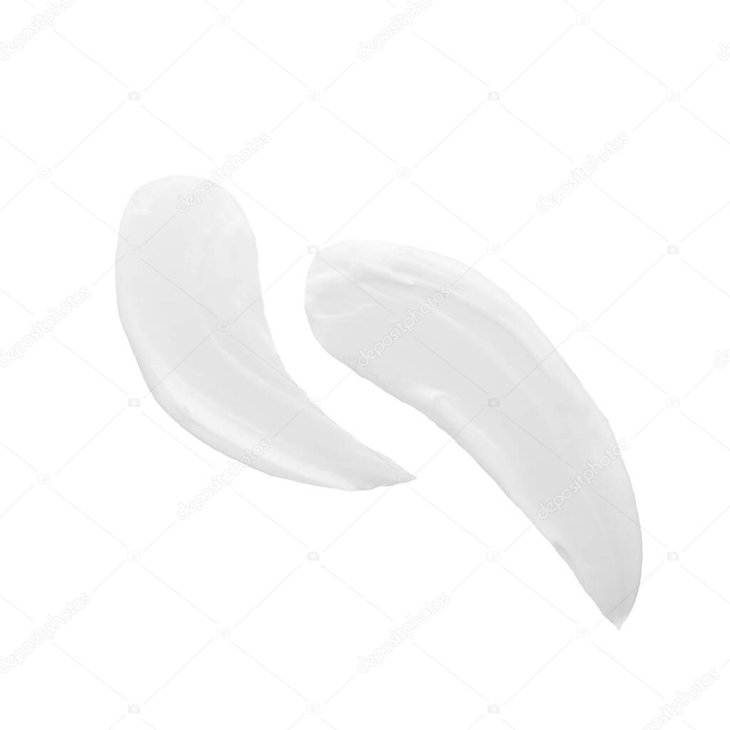 Creamy swipes of cosmetology product isolated on white background. Textured face or body lotion. Facial procedure. Professional skincare and wellness concept.
