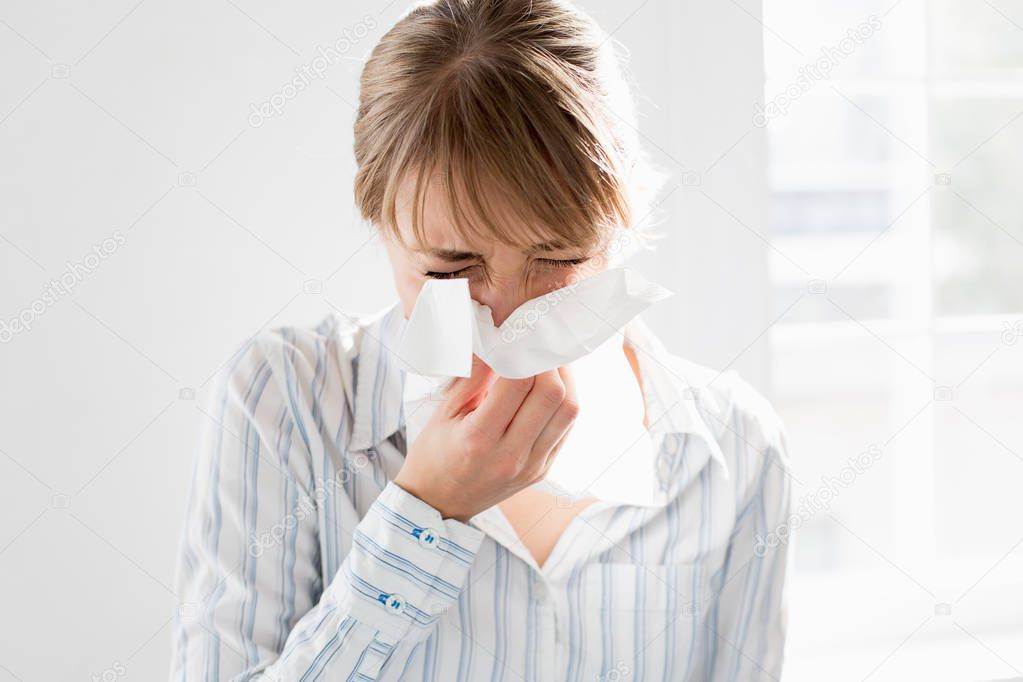  businesswoman blowing nose