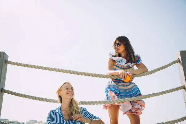 Two Beautiful Female Friends Relaxing Pier Sunny Day — Stock Photo, Image