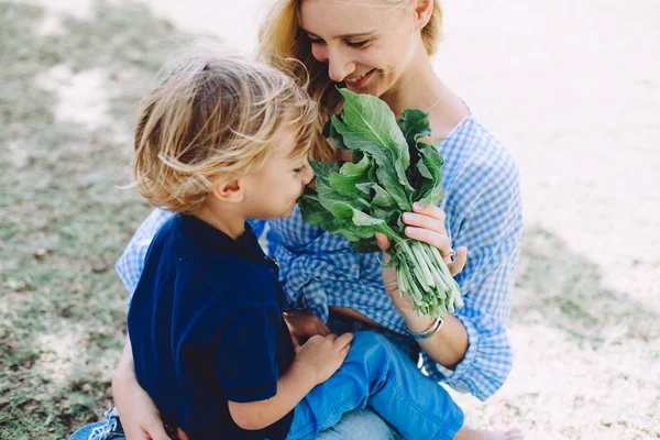 Young Woman Feeding Her Little Son Healthy Food Summer Picnic — Stock Photo, Image