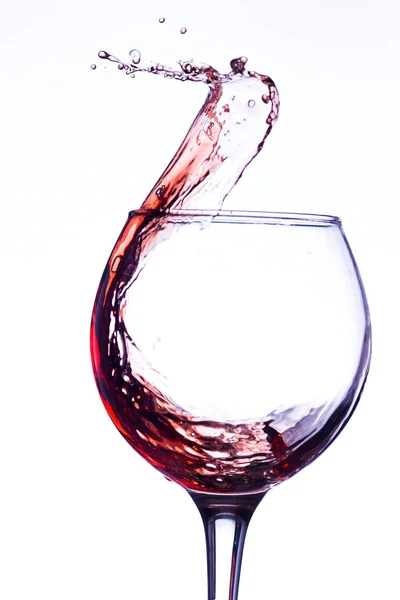 Wein spritzt im Glas — Stockfoto