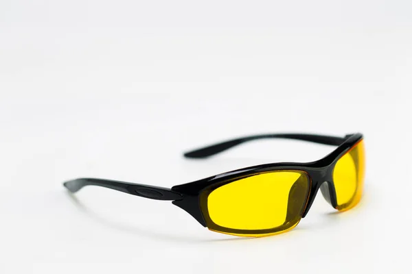 Sunglasses with yellow lenses on a white background — Stock Photo, Image