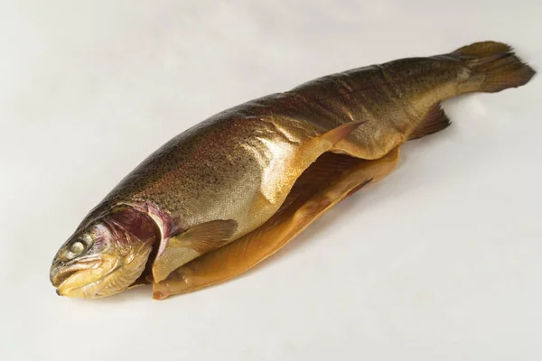 Cold smoked rainbow trout on a white background Stock Picture