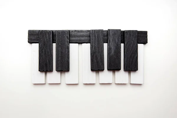 Piano keys on a white background. Learn music. School of Music. Toy piano.