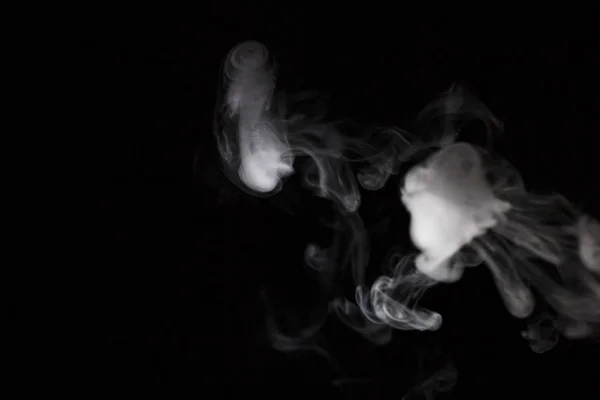 Smoke slaves on a black background — Stock Photo, Image