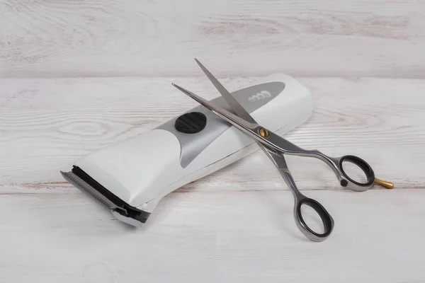 Hairdressing scissors and clipper