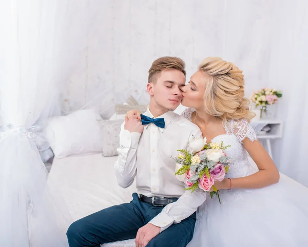 Stylish wedding couple in winter interior