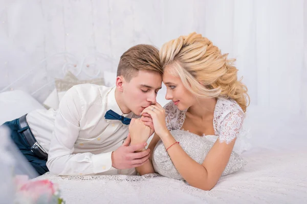 Stylish wedding couple in winter interior