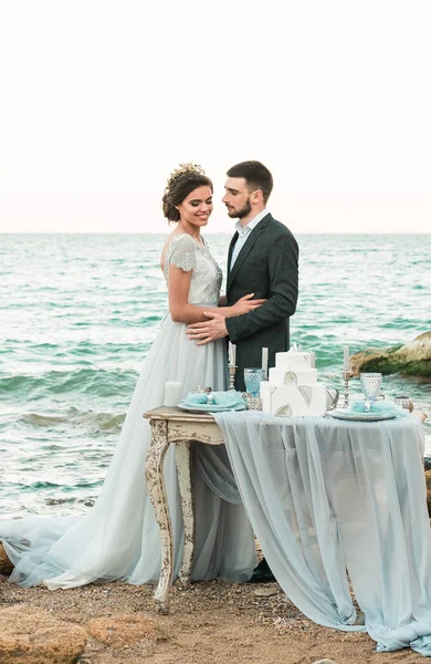 Bride and groom at wedding ceremony near sea — Stock Photo, Image