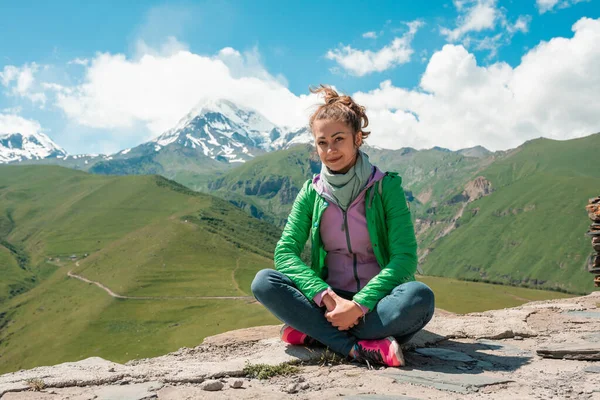 Pretty girl on peak mountain with perfect view.