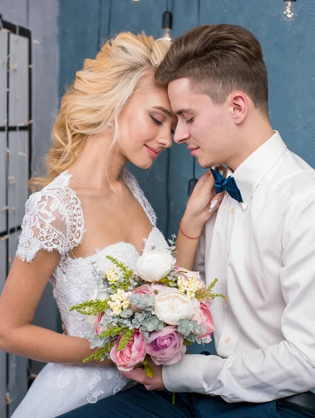 Stylish loving wedding couple in interior studio — Stock Photo, Image