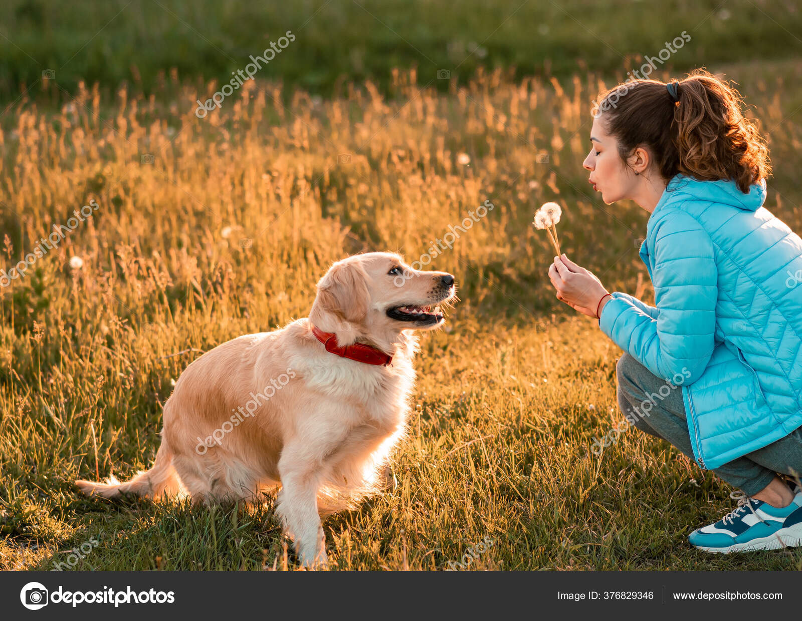Girl blows dog