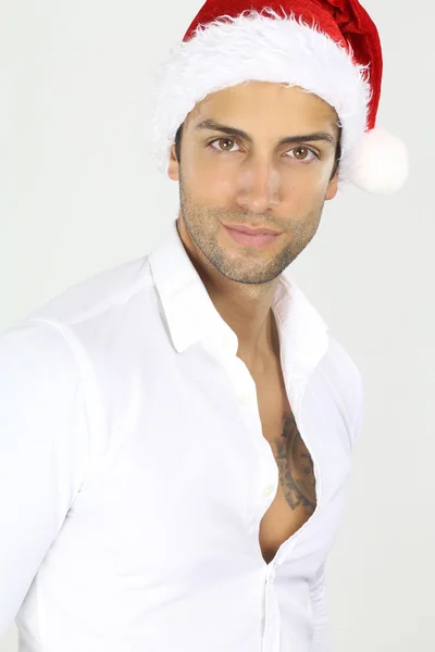 Bello maschio con un cappello da Babbo Natale — Foto Stock