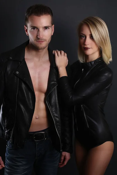 Beautiful couple wearing a leather jacket — Stock Photo, Image