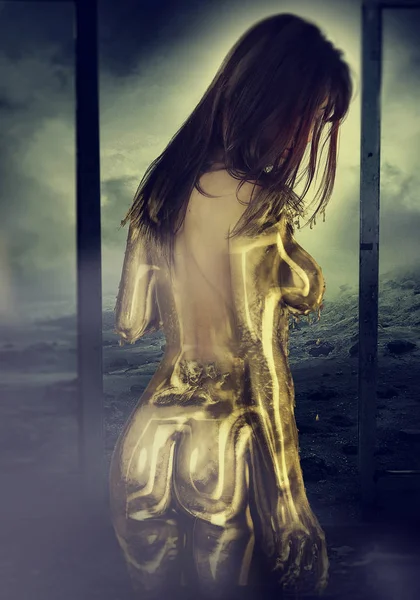 Young woman turning into gold — Stock Photo, Image