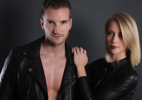 Attractive couple wearing a black leather jacket — Stock Photo, Image