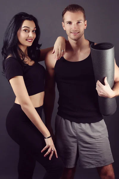 Sporty couple wearing fitness clothes — Stock Photo, Image