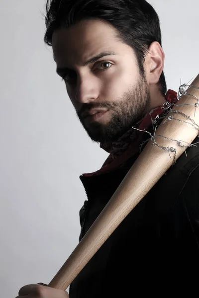 Handsome man holding a baseball bat — Stock Photo, Image