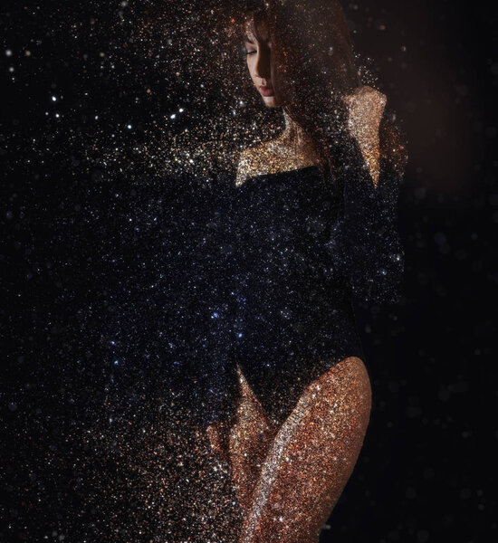 Dispersion of a beautiful woman on a black background