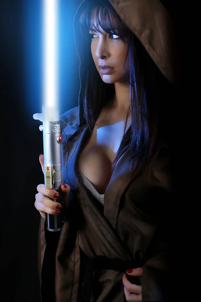 Sexy girl holding a light saber — Stock Photo, Image