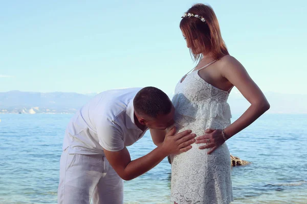 Future dad kissing belly of his pregnant wife — Stock Photo, Image