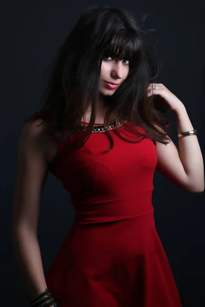 Beautiful woman wearing a red dress — Stock Photo, Image