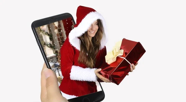 快乐欢快的女人在红色的圣诞老人服装出来的智能手机 白色背景的圣诞概念 — 图库照片