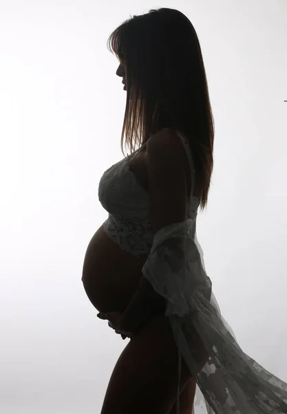 Silhuetten Ung Gravid Kvinna Isolerad Vit Bakgrund — Stockfoto