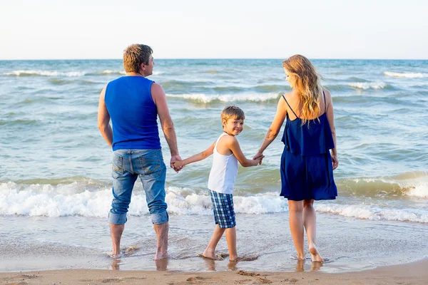 Family of three having fun at the beach — Stock Photo, Image