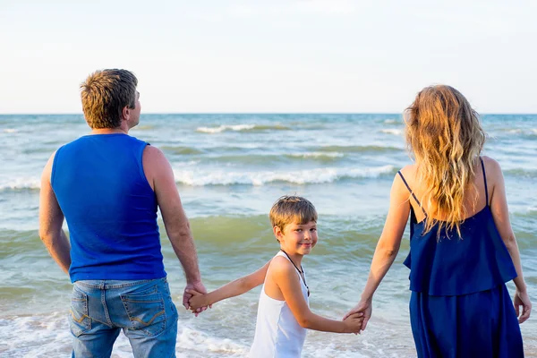 Family of three having fun at the beach — Stock Photo, Image