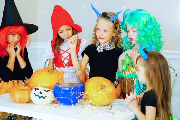 Happy group of children in costumes during Halloween party — Stock fotografie