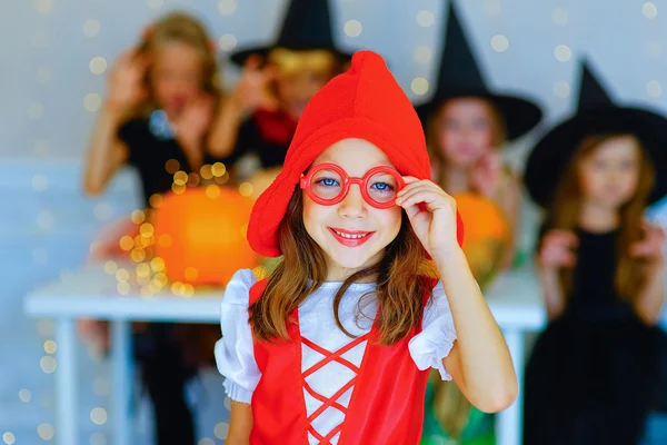 Happy group of children in costumes during Halloween party — Stock fotografie