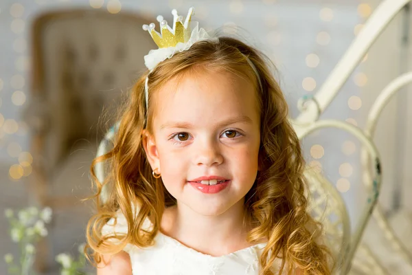 Little princess sitting near the table — Stock Photo, Image
