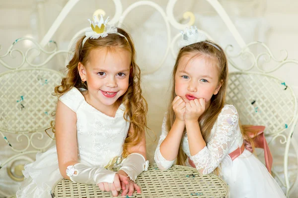 two little princess near the table