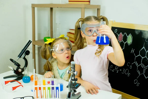 Kids making science experiments Stock Image