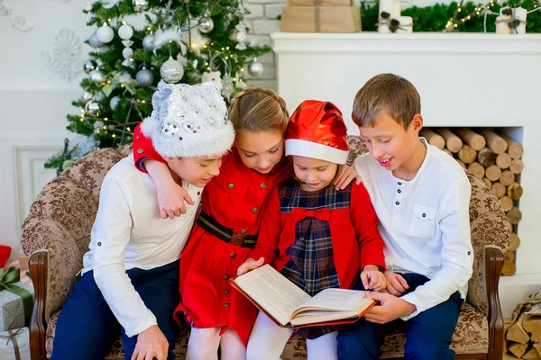 Kids reading a story book on Christmas time