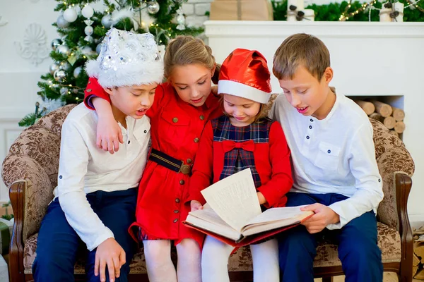 Kids reading a story book on Christmas time