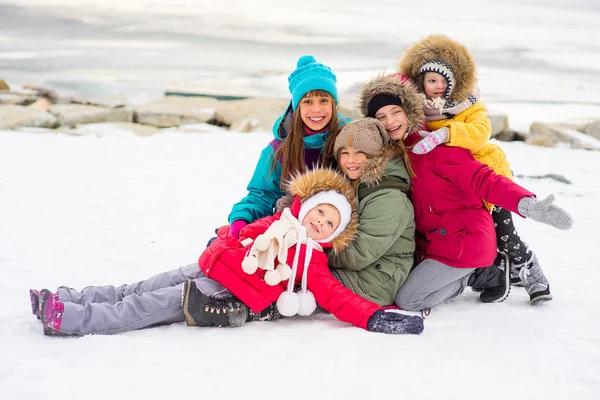 Group of young girls on the frozen lake — Stock Photo, Image