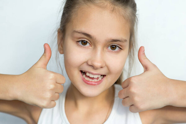 Young girl posing on white background isolated