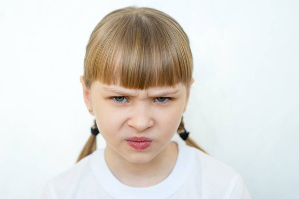 Young girl posing on white background isolated