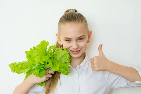 Happy fitness girl holding lettuce isolated — Stock Photo, Image