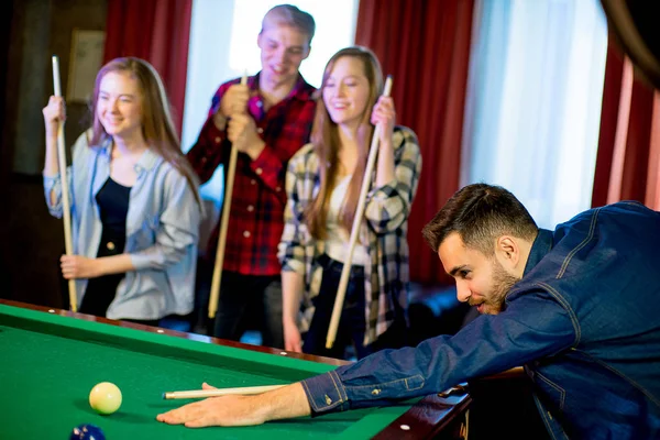 Friends playing billiard Royalty Free Stock Photos