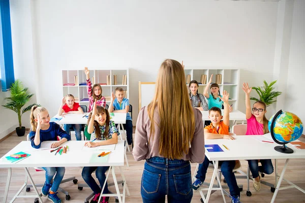 Students raising hands